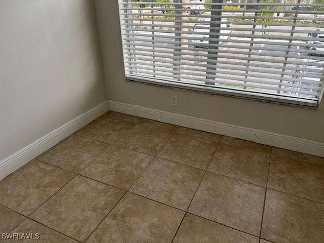 142 Santa Clara Dr Unit 7, Naples, FL 34104 - interior space featuring a healthy amount of sunlight, baseboards, and tile patterned floors