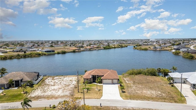 aerial view with a residential view and a water view