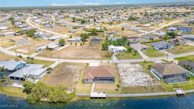 aerial view featuring a water view and a residential view