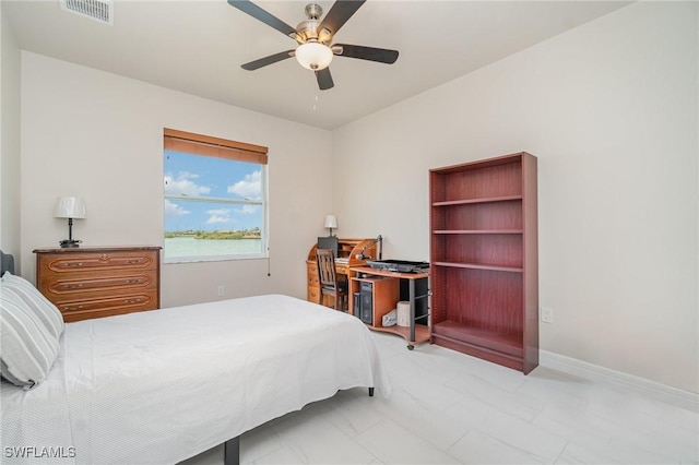 bedroom featuring a ceiling fan, visible vents, and marble finish floor
