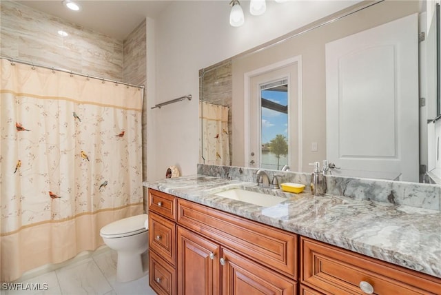 bathroom with curtained shower, vanity, toilet, and marble finish floor