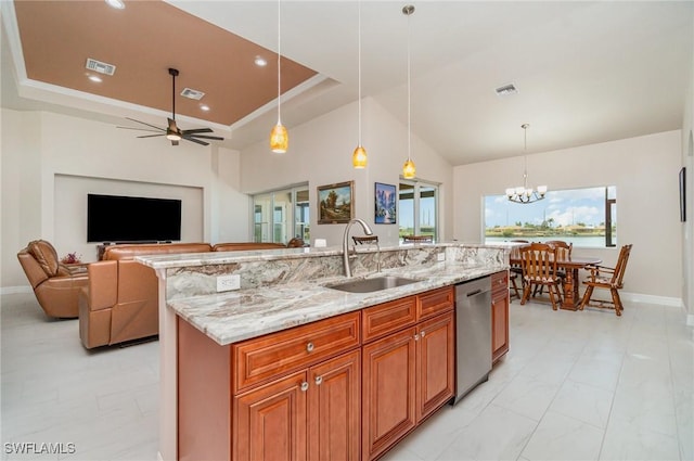 kitchen with dishwasher, a sink, open floor plan, and visible vents