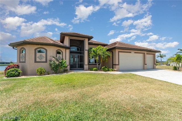 view of front of house featuring a tile roof, driveway, an attached garage, and stucco siding