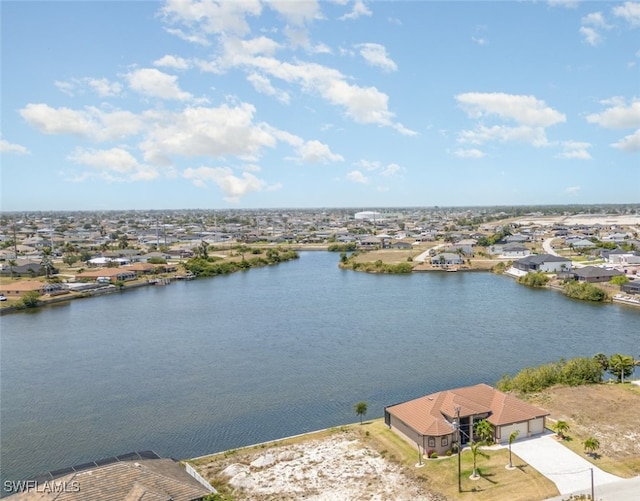 bird's eye view with a residential view and a water view