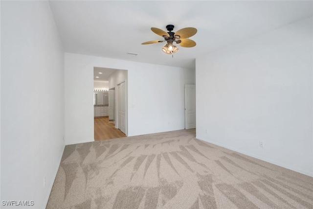 9040 Palmas Grandes Blvd Unit 101, Bonita Springs, FL 34135 - spare room with light carpet and a ceiling fan