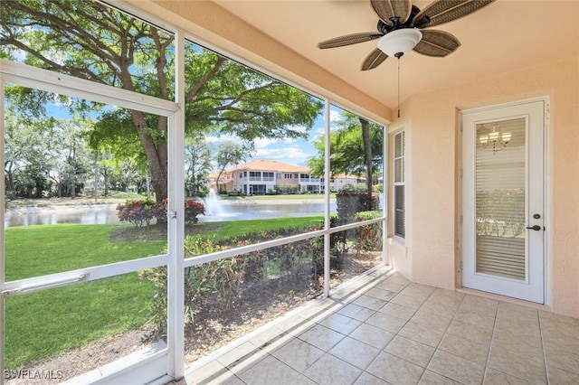 9040 Palmas Grandes Blvd Unit 101, Bonita Springs, FL 34135 - unfurnished sunroom featuring a water view and ceiling fan