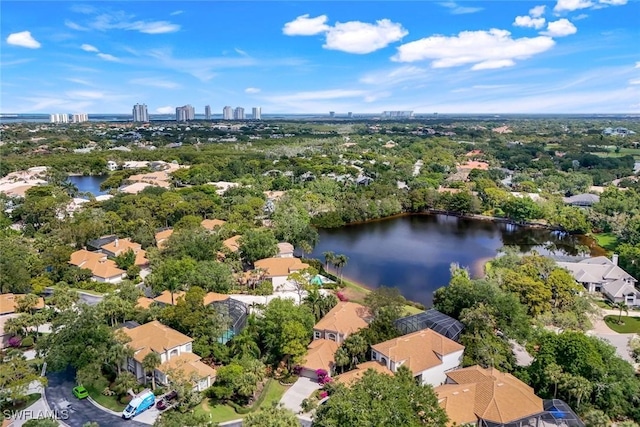bird's eye view with a residential view, a water view, and a city view