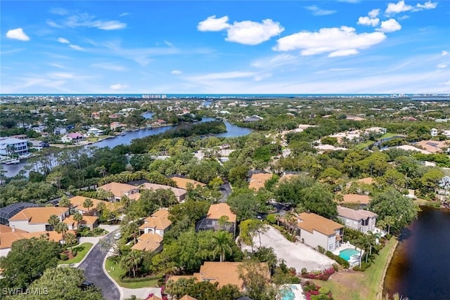 bird's eye view featuring a residential view and a water view