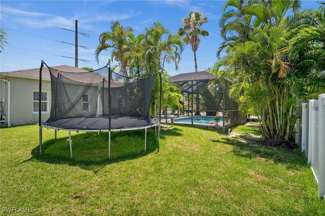2017 Cape Coral Pkwy W, Cape Coral, FL 33914 - view of yard with a trampoline and an outdoor pool