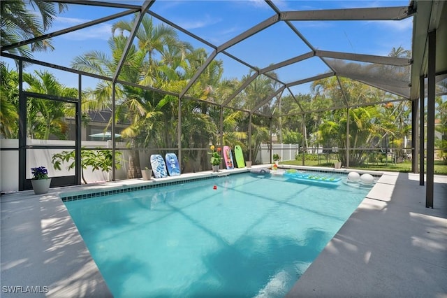 2017 Cape Coral Pkwy W, Cape Coral, FL 33914 - view of swimming pool featuring a patio area and glass enclosure
