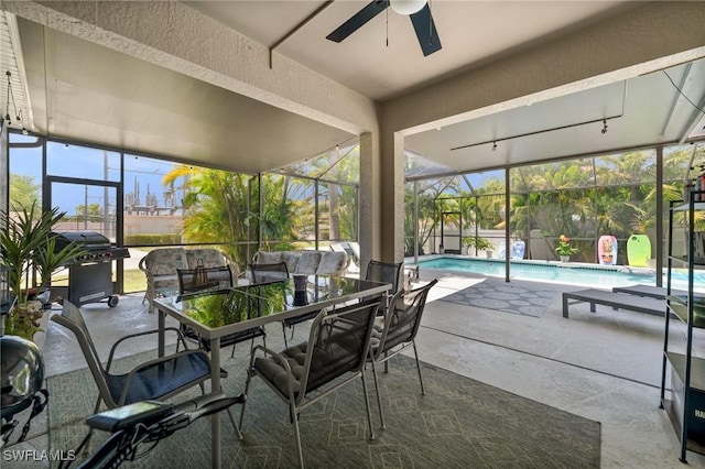2017 Cape Coral Pkwy W, Cape Coral, FL 33914 - sunroom with ceiling fan and outdoor dining space