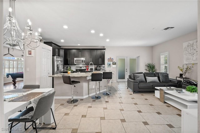 2017 Cape Coral Pkwy W, Cape Coral, FL 33914 - living room featuring recessed lighting, billiards, and a chandelier