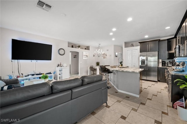 2017 Cape Coral Pkwy W, Cape Coral, FL 33914 - living area with a chandelier, recessed lighting, and light tile patterned floors