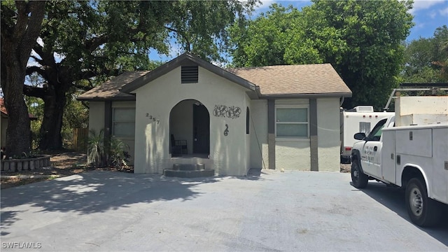2357 Crawford St, Fort Myers, FL 33901 - bungalow-style house featuring a shingled roof and stucco siding