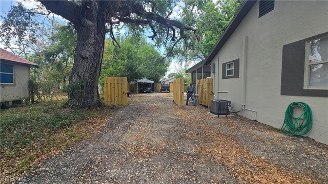 2357 Crawford St, Fort Myers, FL 33901 - view of home's exterior with central air condition unit and stucco siding