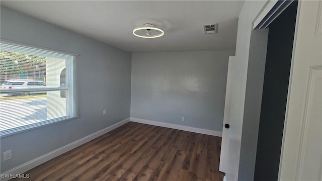 2357 Crawford St, Fort Myers, FL 33901 - empty room featuring visible vents, dark wood-style floors, and baseboards