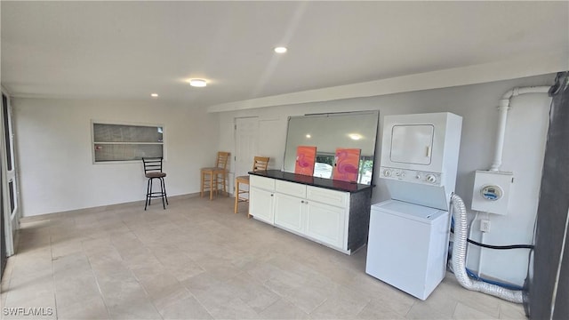 2357 Crawford St, Fort Myers, FL 33901 - washroom with stacked washer and clothes dryer, recessed lighting, and laundry area