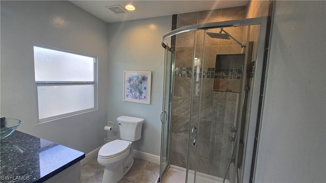 2357 Crawford St, Fort Myers, FL 33901 - bathroom featuring visible vents, toilet, a stall shower, and baseboards