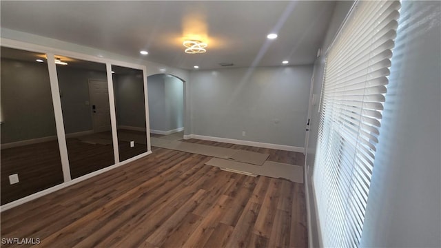 2357 Crawford St, Fort Myers, FL 33901 - spare room featuring baseboards, recessed lighting, arched walkways, and wood finished floors