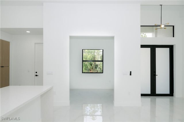 foyer entrance featuring recessed lighting, baseboards, and light tile patterned floors