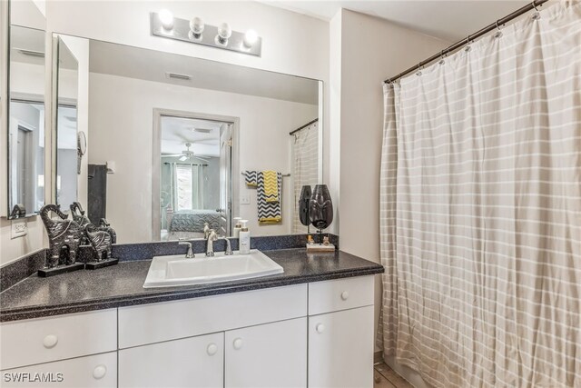 705 Columbus Blvd S, Lehigh Acres, FL 33974 - full bath with ensuite bathroom, vanity, and ceiling fan