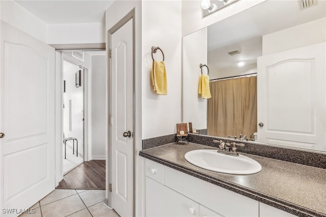 705 Columbus Blvd S, Lehigh Acres, FL 33974 - bathroom with tile patterned floors and vanity