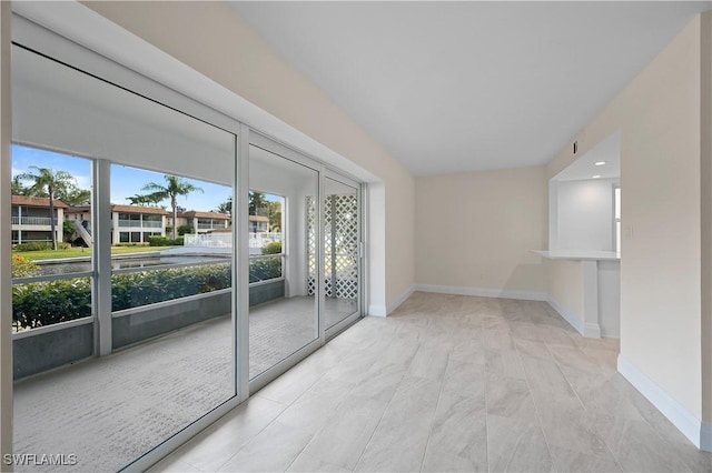 1155 Sandpiper St Unit E1, Naples, FL 34102 - spare room featuring baseboards