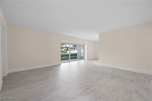 1155 Sandpiper St Unit E1, Naples, FL 34102 - empty room featuring baseboards