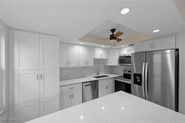 1155 Sandpiper St Unit E1, Naples, FL 34102 - kitchen with stainless steel appliances, a ceiling fan, white cabinets, and recessed lighting