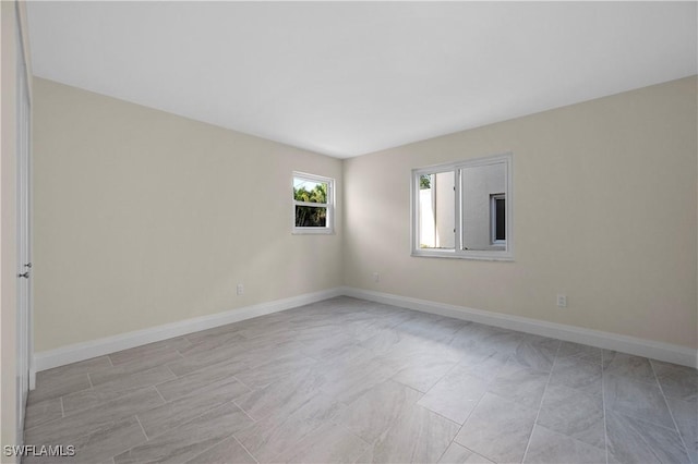 1155 Sandpiper St Unit E1, Naples, FL 34102 - spare room with baseboards