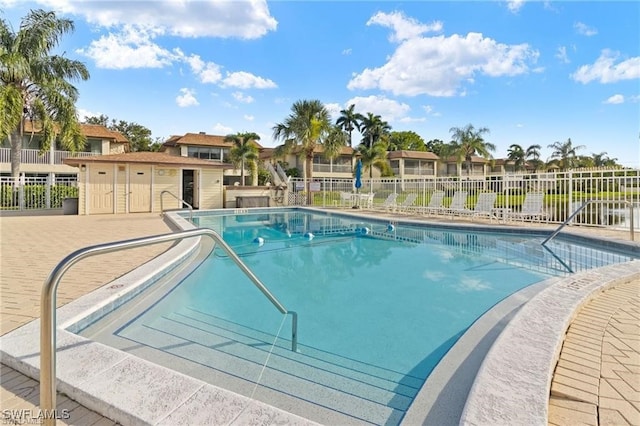 1155 Sandpiper St Unit E1, Naples, FL 34102 - community pool featuring a residential view