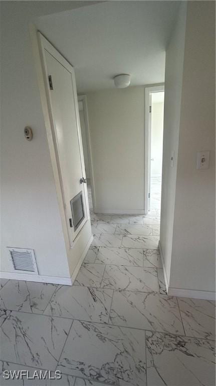 2213 Gardenia Way, Lehigh Acres, FL 33936 - corridor with visible vents, baseboards, and marble finish floor