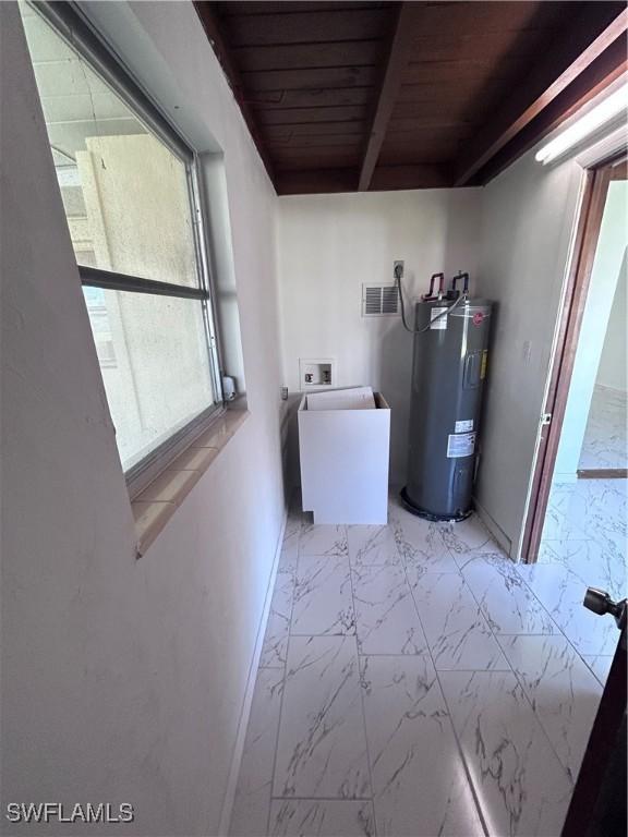 2213 Gardenia Way, Lehigh Acres, FL 33936 - laundry area with baseboards, hookup for a washing machine, water heater, wood ceiling, and laundry area