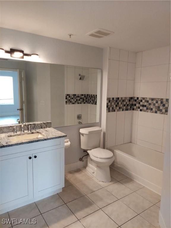 full bathroom with tile patterned floors, visible vents, vanity, and toilet
