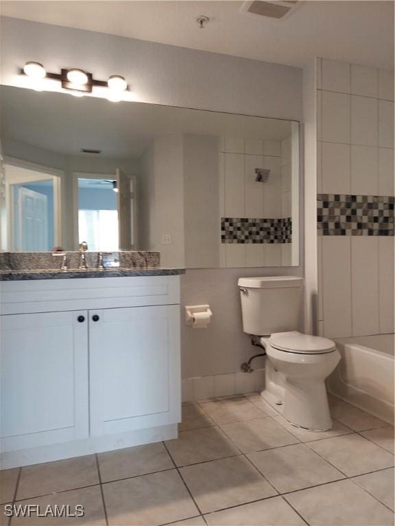 full bath featuring toilet, vanity, tile patterned floors, and visible vents
