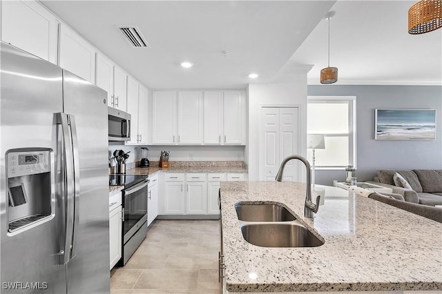 kitchen with visible vents, stainless steel appliances, white cabinetry, and a sink