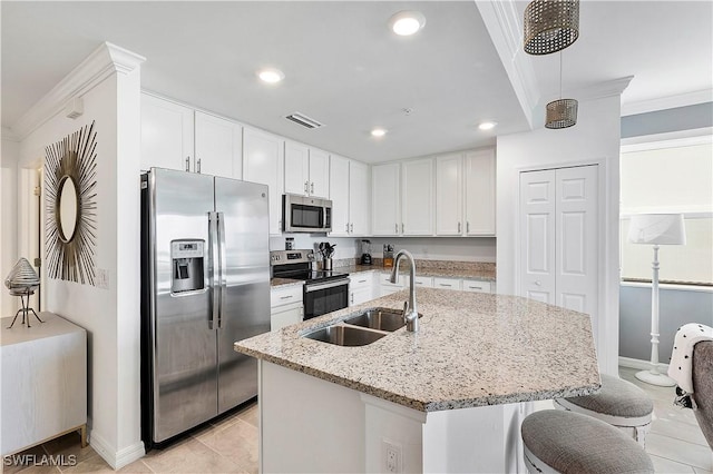 kitchen featuring appliances with stainless steel finishes, light tile patterned floors, visible vents, and a sink