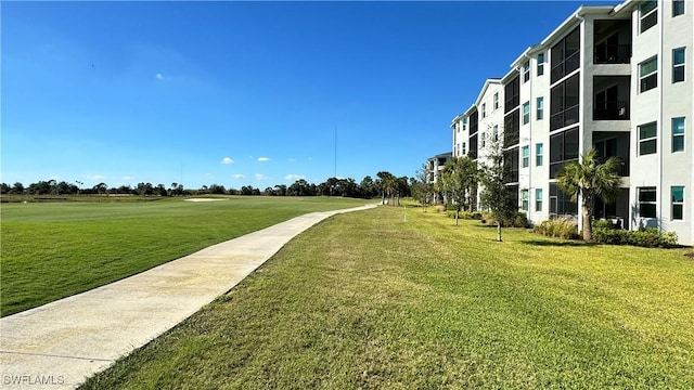 view of home's community with a lawn