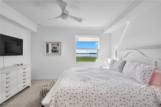 bedroom featuring baseboards, ornamental molding, ceiling fan, and light colored carpet