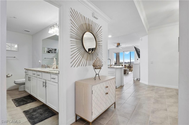 bathroom with tile patterned floors, crown molding, toilet, a ceiling fan, and visible vents