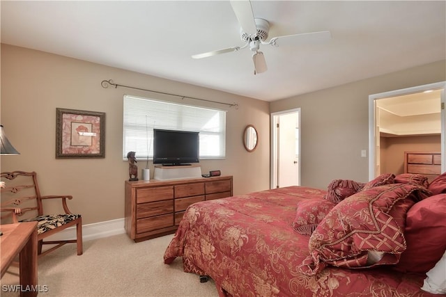 bedroom with baseboards, ceiling fan, and light colored carpet