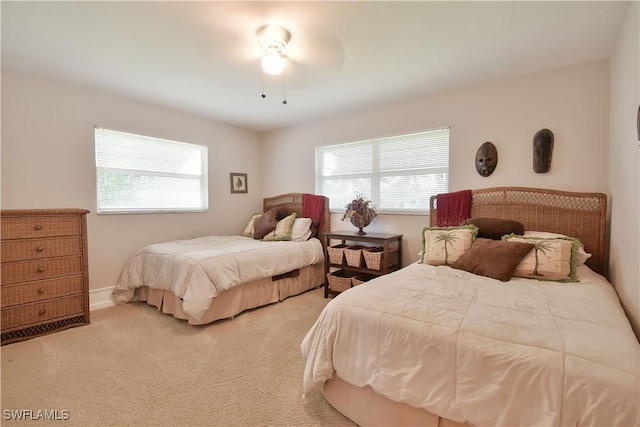 bedroom featuring carpet and baseboards