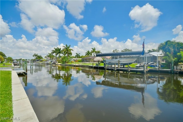 view of dock with boat lift and a water view