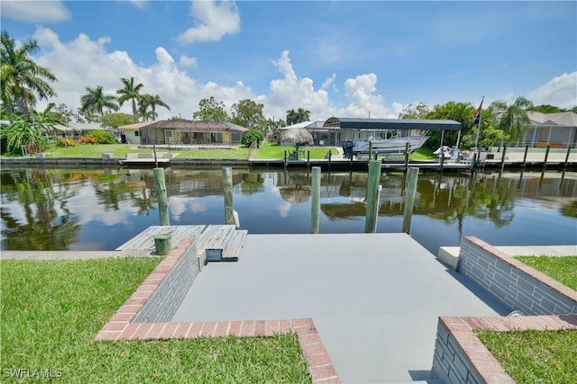 view of dock with a residential view and a water view