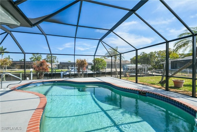 outdoor pool featuring a lanai and a patio area