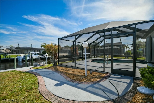 view of community with a swimming pool, a dock, boat lift, and a water view