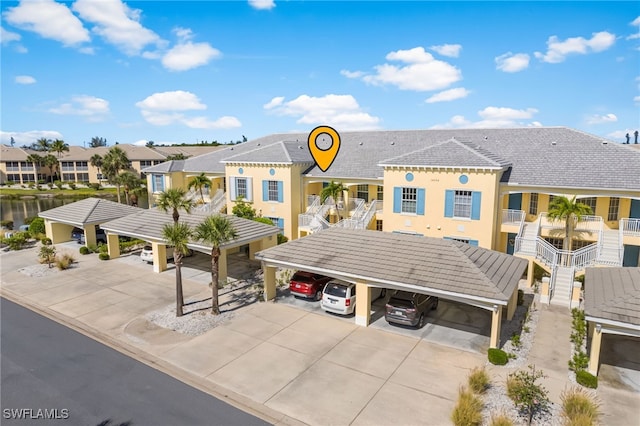 14524 Abaco Lakes Dr Unit 203, Fort Myers, FL 33908 - view of property featuring stairway and a residential view