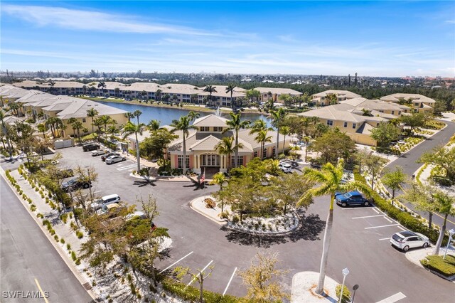 14524 Abaco Lakes Dr Unit 203, Fort Myers, FL 33908 - birds eye view of property featuring a water view and a residential view