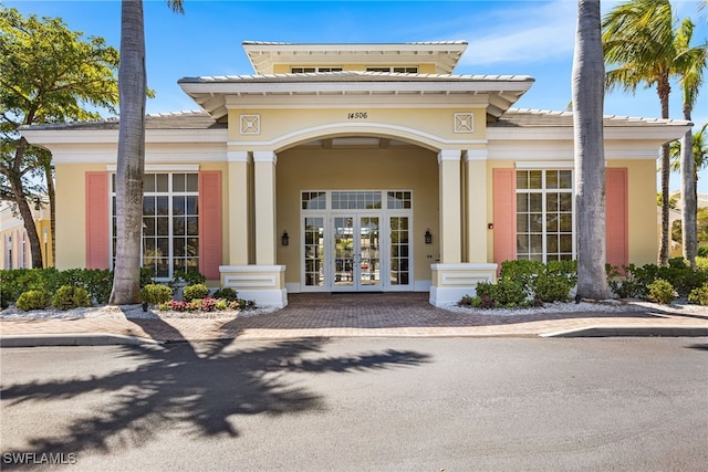 14524 Abaco Lakes Dr Unit 203, Fort Myers, FL 33908 - exterior space with stucco siding, a tile roof, and french doors