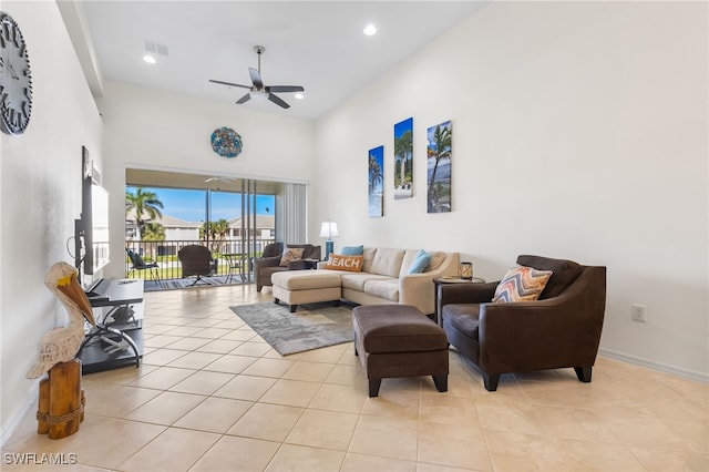 14524 Abaco Lakes Dr Unit 203, Fort Myers, FL 33908 - living room featuring visible vents, ceiling fan, light tile patterned floors, a high ceiling, and baseboards